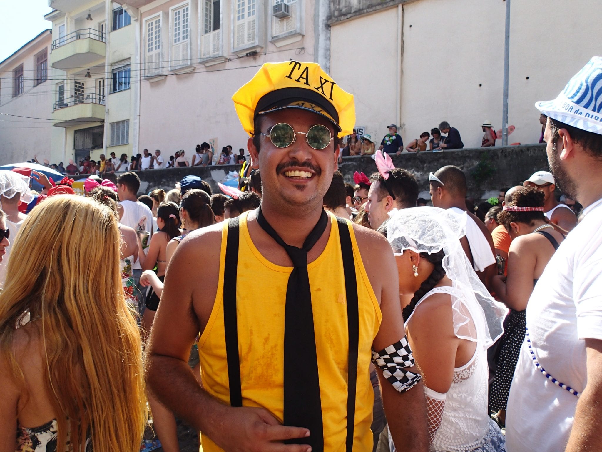 a man dressed as a taxi driver at rio carnival