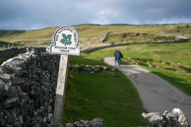 A National Trust Sign reading "Malham Cove Field"