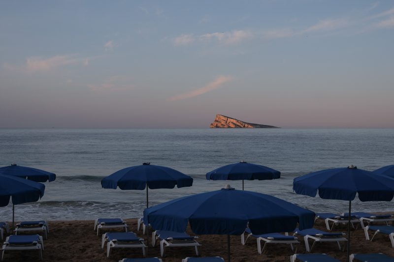 the Isle of Benidorm as seen from the beach at sunset